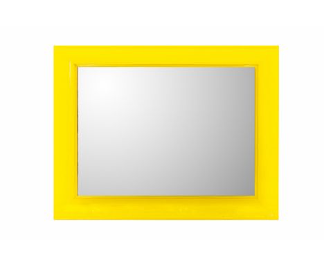 A PHILLIPE STARCK WALL MIRROR With a yellow translucent border 110cm high x 86cm Condition: There are marks and abrasions aro