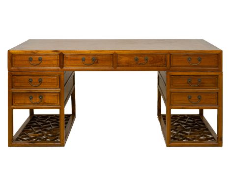 A CHINESE TWIN PEDESTAL DESK The top with four frieze drawers, each pedestal fitted with a further two drawers beneath and a 