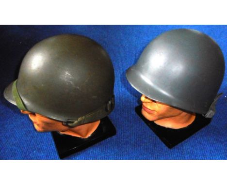 Two American army helmets with modern inserts.