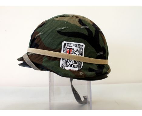 American army helmet "dollied up" to look like Vietnam era.