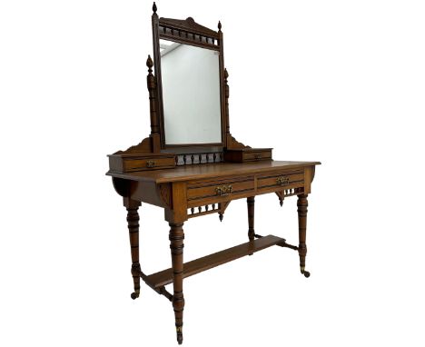 Late Victorian Aesthetic Movement walnut and inlaid ebony dressing table, swing mirror back with shell carving and spindle su