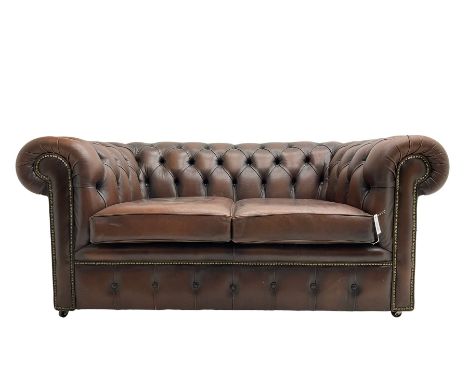 Chesterfield two seat sofa, upholstered in brown buttoned leatherDimensions: Height:&nbsp;72cm&nbsp; Length/Width:&nbsp;164cm