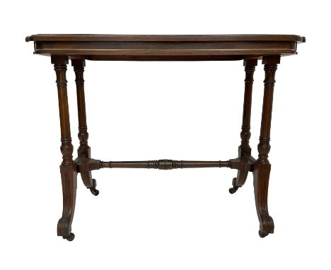 Late Victorian rosewood stretcher table, the rectangular top with curved canted cornice and moulded edge, on quadruple turned