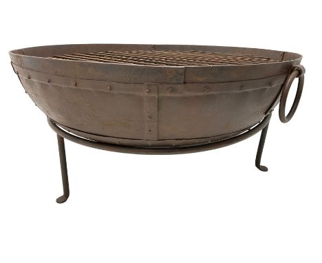 Circular riveted iron fire pit, strapwork sides with twin handles on stand, with grateDimensions: Height:&nbsp;45cm&nbsp; Len