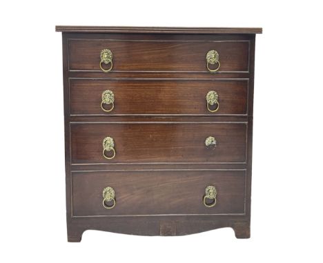 Early 19th century mahogany commode chest, reeded edge over four faux drawers with cock-beaded facias and brass lion mask rin