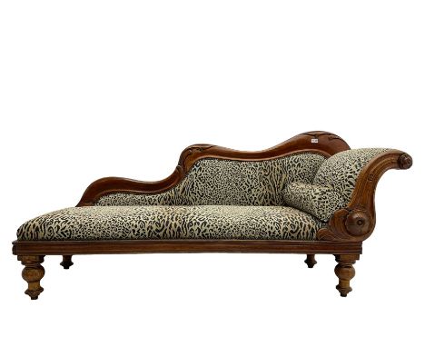 Victorian mahogany framed chaise longue, shaped arm carved with acanthus leaves, the scrolled back with applied carved rosett
