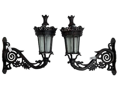 Pair of Victorian design cast metal garden wall lamp and bracket, the support pierced and decorated with scrolling and foliat