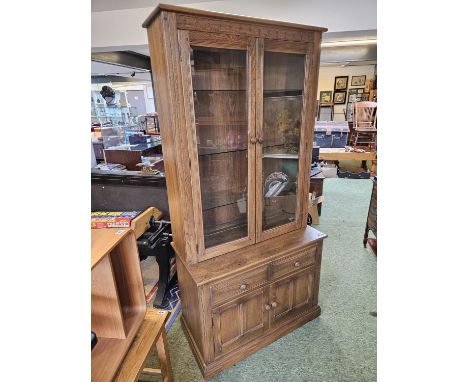 Ercol Golden Dawn Glazed display cabinet with panelled doors 