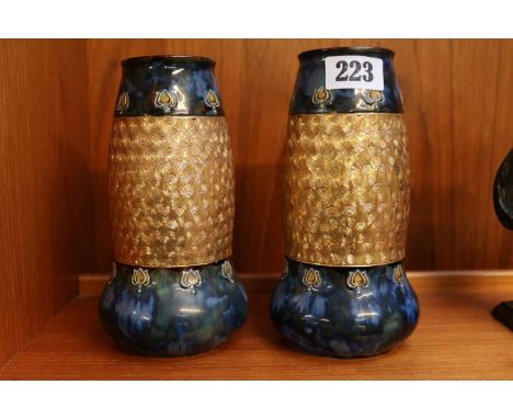 Pair of Royal Doulton Art Nouveau design vases with gilded decoration on turquoise ground 