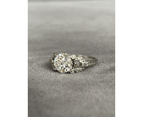 A 1920s Art Deco Platinum Diamond Ring Set with a 1.85ct Old Cut centre Stone of a high-quality D/F Colour &amp; VS1/2 clarit