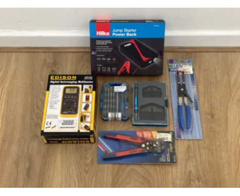 Tools unopened including jump starter pack, digital auto ranging multimeter and wire stripper cutter and crimper