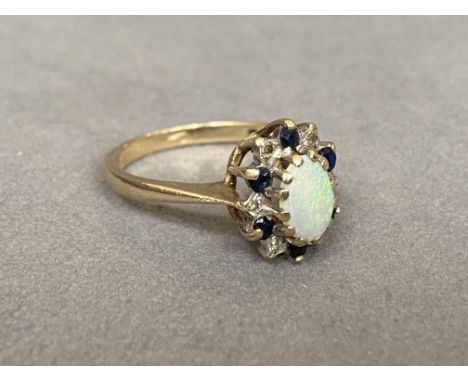 9ct Yellow Gold Cluster Ring with a Stunning Opal Centre Stone surrounded by Diamonds &amp; Sapphires - Weighing 2.64 grams -