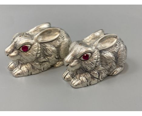 A pair of silver-plated rabbit condiments with ruby eyes, weight 111.39grams
