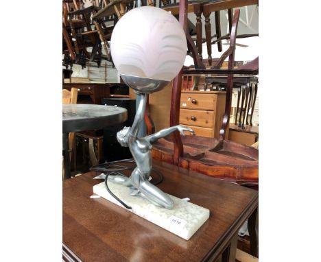 An Art Deco lady figure lamp with glass spherical shadeCondition: no signs of damage or repairs.