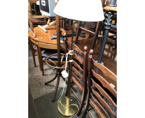 A brass adjustable reading lamp 