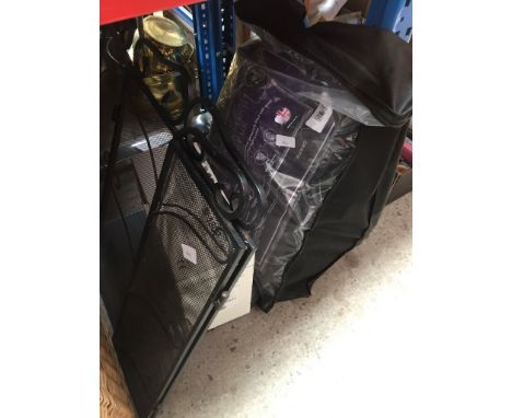 A collection of items to include a tank pump, A portable gas cooker, a fire screen, a bag of roller blades and pads 