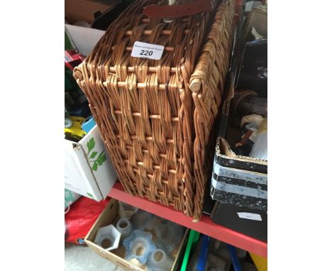 A picnic set in a wicker hamper 