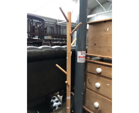 A light wood coat stand 