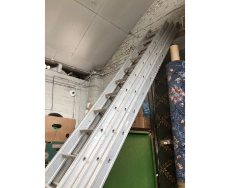 A triple extension aluminium ladder - total height approx 45 ft 