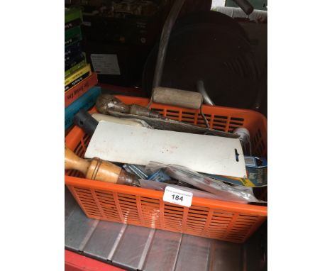 A tub of hand tools and a cable reel 