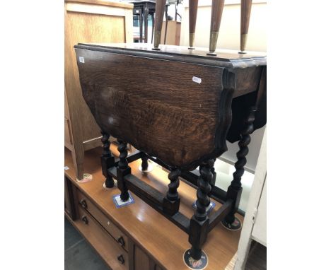 An oak gate leg table with pie crust edge 