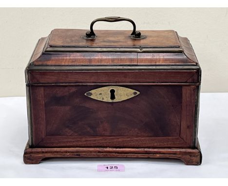 A George III mahogany pagoda topped tea caddy on bracket feet. 10" wide. Interior gutted.