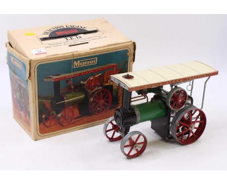 A Mamod TE1A traction engine comprising green body with red wheels, complete with canopy, housed in the original card box, mo