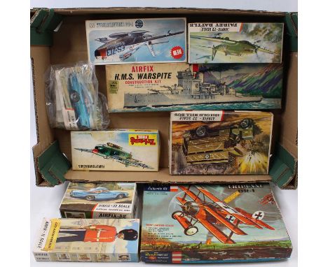 A collection of mixed plastic military civilian and car plastic kits to include a Revell Fokker triplane DR-1, an Airfix HMS 