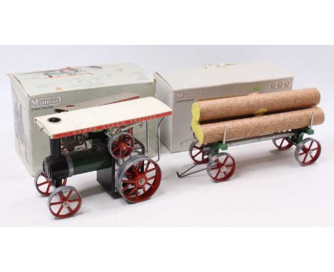 A Mamod TE1A steam tractor, of usual specification housed in the original card box, little used, with matching log trailer