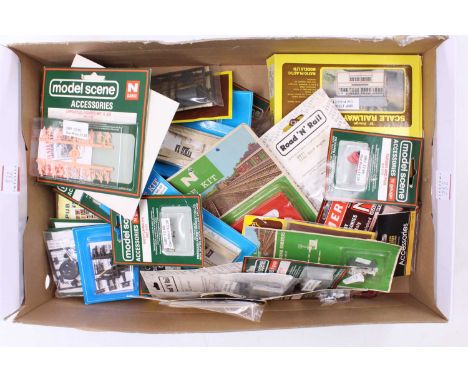 A very large shoe or boot box containing approx 40 packets of N-gauge items including model animals, suitcases, spare wheels,
