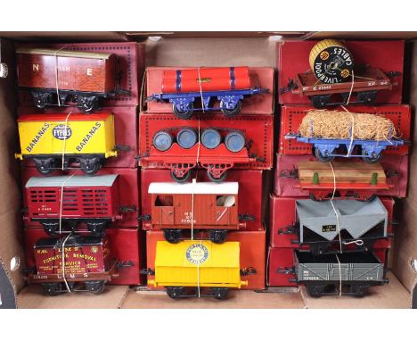 Large tray containing thirteen boxed Hornby goods wagons, mix of pre &amp; post-war: NE fish; Fyffes banana; BR maroon milk t