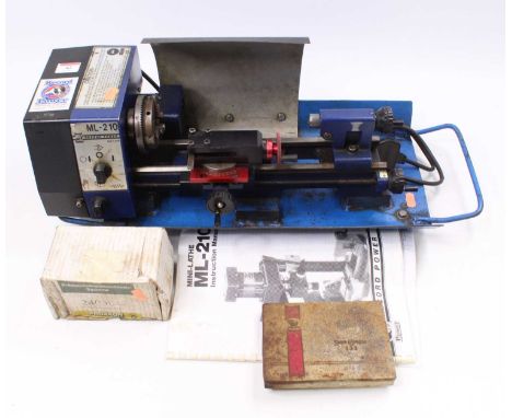 A Record ML-210 Table Top Lathe, with booklet and tin of spares/toolsUnable to test this item.Length 49cm. Full length 60cm. 