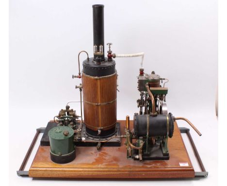 A very well engineered gas powered live steam plant comprising of large vertical wooden clad gas powered boiler with sight gl