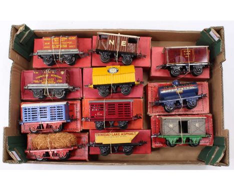 Large tray containing eleven boxed Hornby goods wagons, mix of pre &amp; post-war: NE flat with container; LMS flat with cont