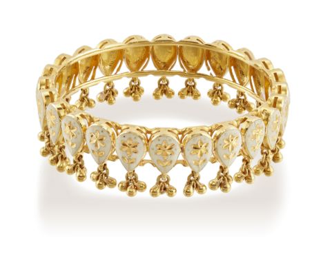An enamel bangle, a series of teardrop panels with engraved floral decoration to a white enamel ground, suspending beaded tas