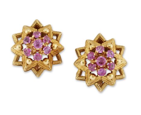 A pair of 18ct gold ruby stud earrings, with a cluster of round mixed cut rubies claw set to pierced star form mounts, Italia