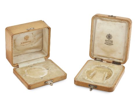 Faberg&eacute;. Two holly wood empty jewel hinged boxes, of typical form each with plush and silk linings and ink stamped Fab