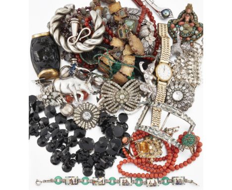 A collection of jewellery, including: an Art Deco Egyptian Revival silver bracelet with enamelled panels joined by green glas