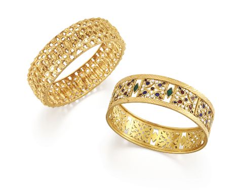 Two pierced bangles, one of facetted and beaded design, inner diameter 5.5cm, width 1.7cm; the other with polychrome enamel a