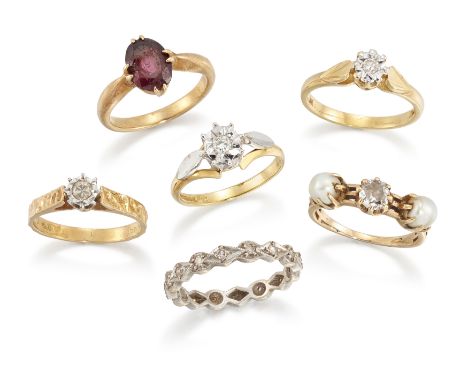 A group of six diamond and gem rings, comprising: three diamond single stone rings; a diamond and pearl three stone ring; a s