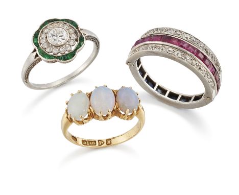 Three diamond and gem set rings,&nbsp;comprising: an Art Deco platinum diamond and emerald target cluster ring, with an old-b