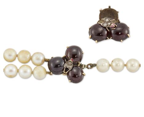 A Victorian cabochon garnet trefoil,&nbsp;with applied central rose-cut diamond set fly, later converted to a clasp, strung w