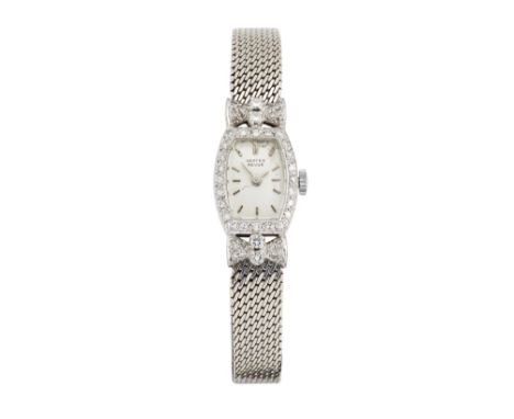 Vertex. A platinum and diamond set manual wind tonneau shaped bracelet watch  Circa 1955 17 jewel manual wind movement, silve
