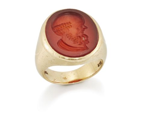 An 18ct gold intaglio ring, the oval cornelian intaglio depicting the profile head of Socrates, London hallmarks, 1914, ring 