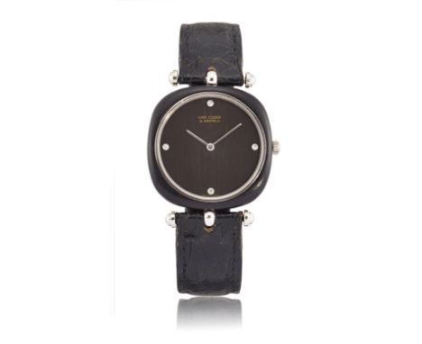 Van Cleef & Arpels, designed by Gerald Genta. A wood, stainless steel and diamond set manual wind wristwatch Circa 1980 Manua