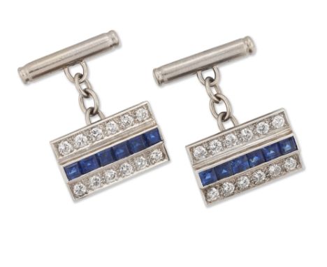 A pair of sapphire and diamond-set cufflinks, the rectangular panels with a central row of step-cut sapphires, with a row of 