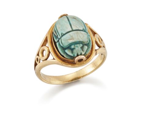A late 19th century gold scarab ring, the composite Egyptian scarab bead in gold mount with openwork shoulders, ring size KCo