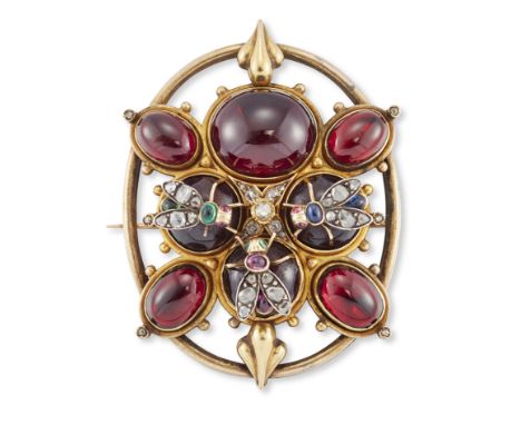 A Victorian gold garnet brooch, set with eight cabochon garnets three of these mounted with rose-cut diamond fly motifs, each