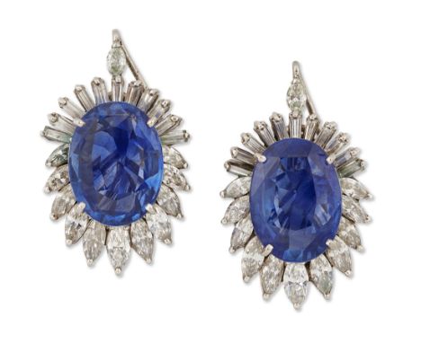 A pair of sapphire and diamond ear clips, each claw set with an oval mixed-cut sapphire, framed with graduated marquise and b