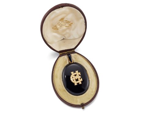 Henry Tessier. A Victorian onyx locket pendant, of oval form, with applied half-pearl set initials 'EM' to one side, and a ha